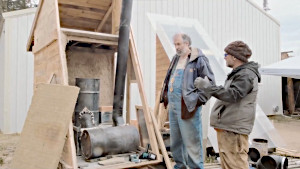 Paul Wheaton looking at the partially built food dehydrator.